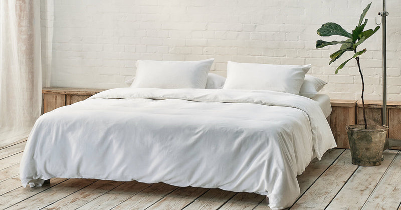 white bedding in a light summer bedroom