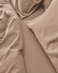 beige bedding set including a fitted sheet, duvet cover and pillowcases