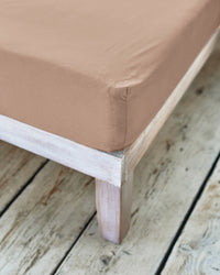 corner of beige fitted sheet