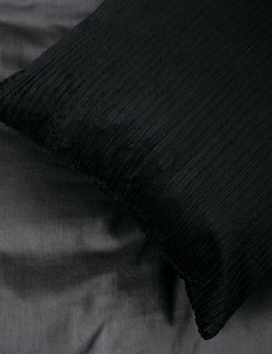 Close up of black corduroy cushion texture. 