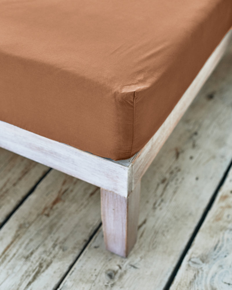 corner detail of caramel brown fitted sheet