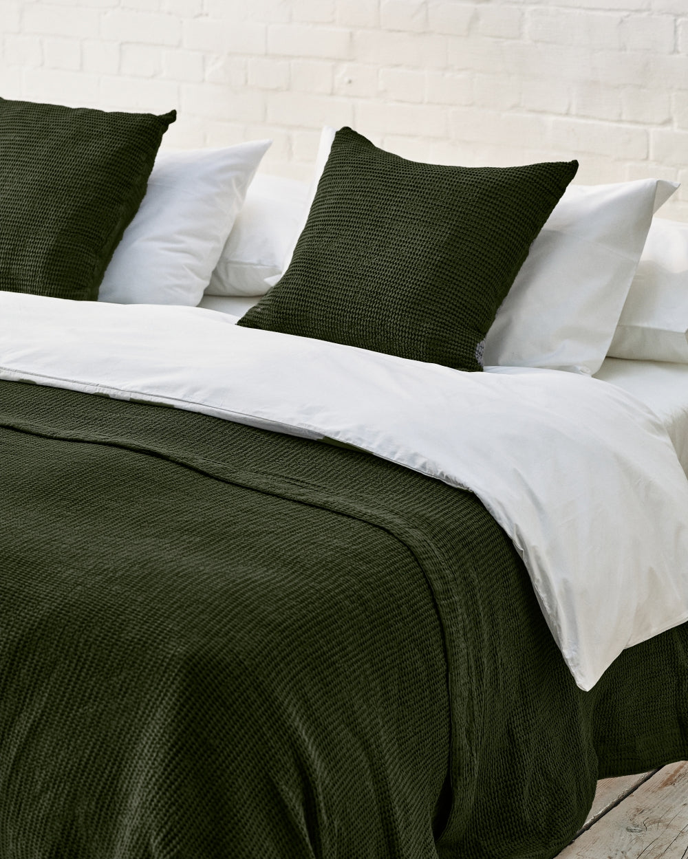 dark green waffle cushion and bedspread
