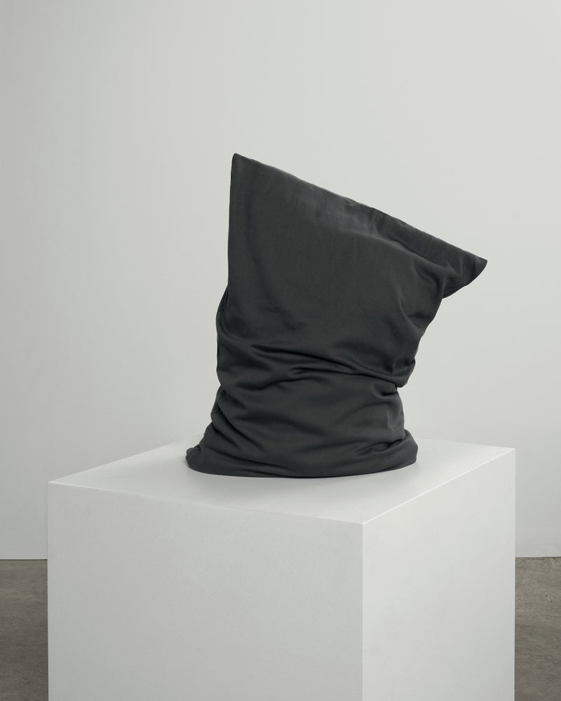 dark grey pillowcase on cube.